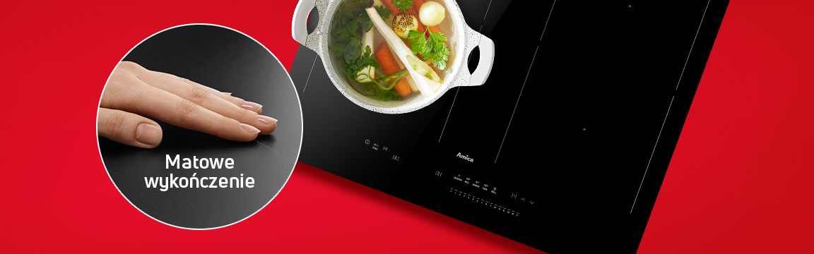 Mężczyzna z garnkiem rosołu, w tle matowa płyta indukcyjna